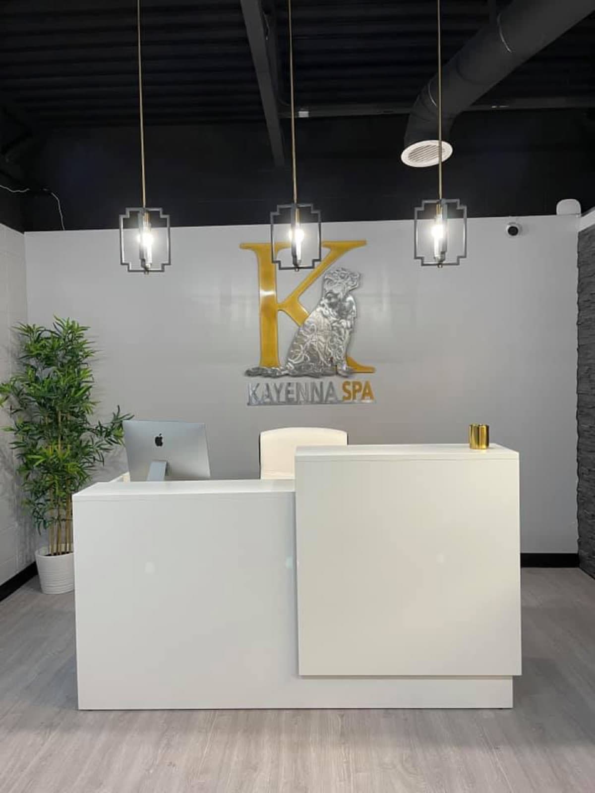 Kayenna Spa front desk with gold logo
